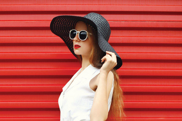 stylish woman wearing white sunglasses